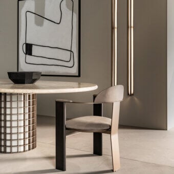 Distinguished Shake Ego armchair with muted beige fabric, varnished steel and solid ash wood, crafted in Italy