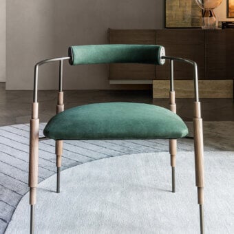 Superior Shake Frame armchair with varnished steel, refined solid ash wood, and muted green textile upholstery