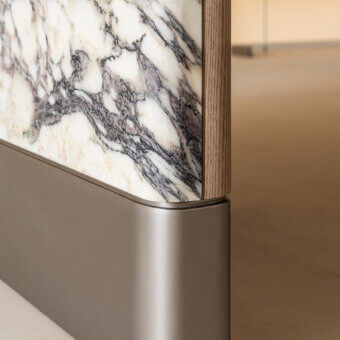 Superior Shake Mayfair table built with honed Breccia Capraia marble and solid ash wood showcasing a sculpted oval silhouette with a curved metal base
