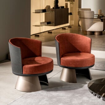 Sophisticated Shake Victor swivel lounge chair with reddish-brown textile and varnished steel base built with a contrasting plywood ash wood frame