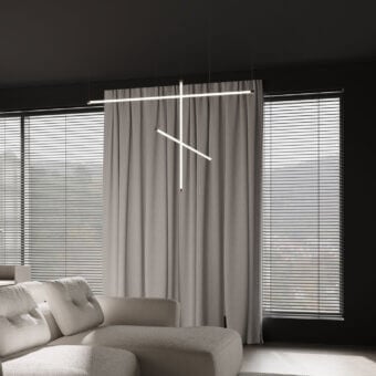 Elegant Stillux Line 1 suspension lamp with geometric form and matte white metal construction emits a warm glow