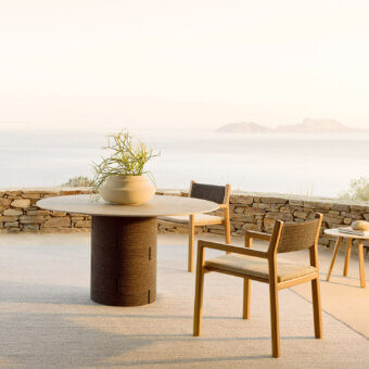 Distinguished Varaschin Gianna dining armchair crafted in Iroko wood with a Desert finish and woven textile backrest