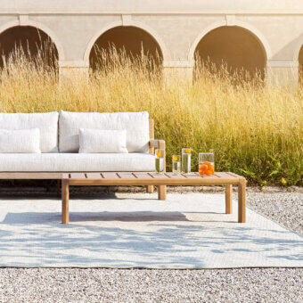 Distinguished Varaschin Gianna coffee table built in Iroko wood with a smooth satin finish and warm medium-toned hue