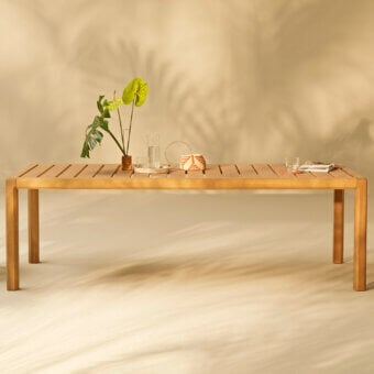 Distinguished Varaschin Gianna dining table crafted in warm brown Iroko wood with a beautiful satin finish