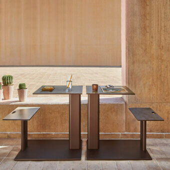 Exceptional Varaschin Plinto sit and eat table crafted in wood with a satin finish and warm dark brown tone