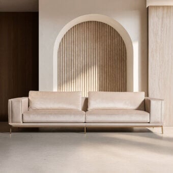 Superior Visionnaire Denzel sofa with muted beige textile upholstery and satin stainless steel base crafted for tailored support