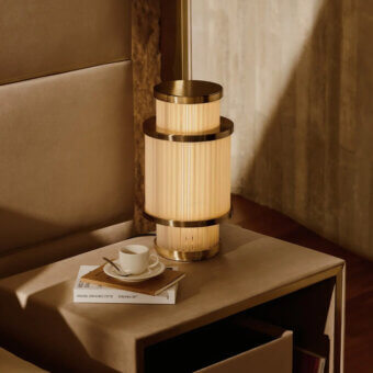 Superior Visionnaire Giano table lamp with a satin steel frame and borosilicate glass rods in PVD gold finish