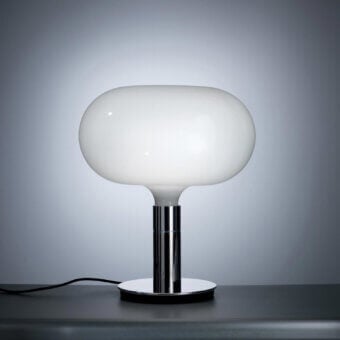 Elegant Nemo AM1N table lamp crafted in white hand-blown glass with a bright silver polished metal stem and base