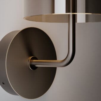 Distinguished VENICEM Doma wall lamp crafted in metal with satin bronze finish emits warm downlight through transparent Murano glass