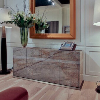 Lavish Bellavista Japo sideboard built with Silver Roots marble and black mahogany veneer, showcasing a polished glossy finish with bronzed brass accents