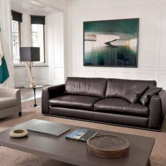 Sophisticated CTS Salotti Andy sofa in dark brown leather with a sleek tubular aluminium base and generously filled cushions