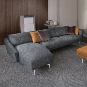 Elegant CTS Salotti Urban sectional with textured dark gray fabric and silver finish aluminum legs