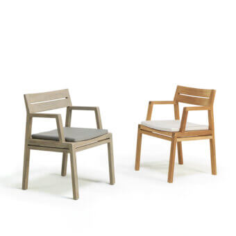 Elegant Ethimo Costes armchair with FSC-certified teak structure and comfortable grey textile cushion in a warm natural finish