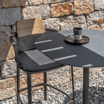 Sophisticated Ethimo Enjoy Bar Table with matte dark gray metal tabletop and conical base, crafted in a minimalist finish