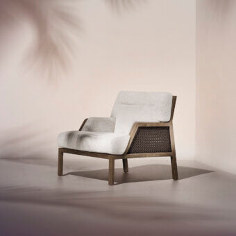 Exceptional Ethimo Grand Life lounge chair crafted with warm wood and a refined off-white weave with satin finish