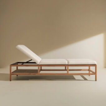 Elegant Ethimo Grand Life lounger with light beige woven detailing and satin-finish wood frame