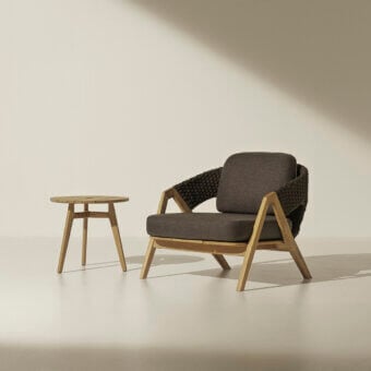 Distinguished Ethimo Knit lounge chair with teak wood frame and woven rope backrest in a muted gray-brown palette