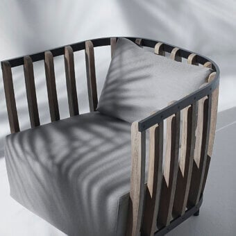 Elegant Ethimo Swing lounge chair with a metal frame, internal teak slats and muted gray matte finish