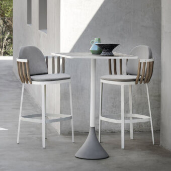 Distinguished Ethimo Swing stool with matte white metal frame and elegant teak wood slats upholstered in gray textile