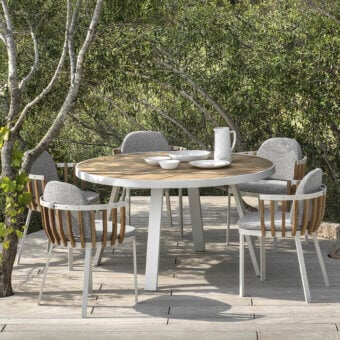 Sophisticated Ethimo Swing table crafted in aluminum with a rhythmic teak slat tabletop and matte finish