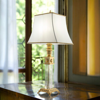 Lavish Laudarte Andromeda table lamp crafted in bronze with 24K gold plating and a clear crystal column