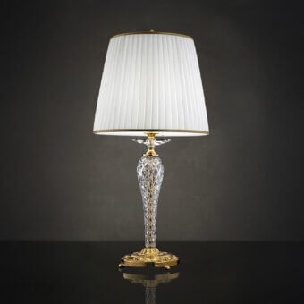 Exclusive Laudarte Carina table lamp with sculpted clear crystal and bronze castings in luminous 24K gold-plated finish