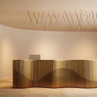 Distinguished Lodes A-Tube Nano Swing ceiling lamp crafted in metal with a satin finish and gold tone
