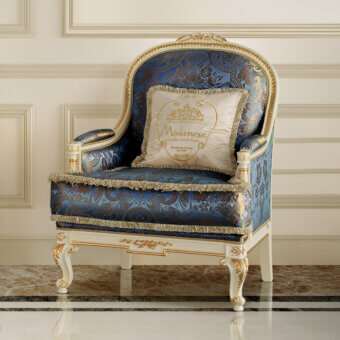 Distinguished Modenese Midnight Moon lounge chair with deep blue textile upholstery and opulent gold leaf accents