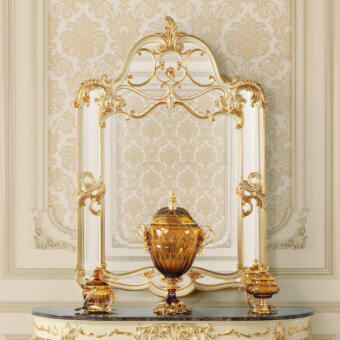 Lavish Modenese Midnight Moon Shaped mirror handcrafted in Italy with ornate carvings and glossy gold accents