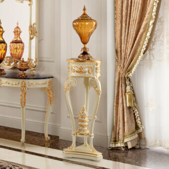 Lavish Modenese Rubino Delight vase stand crafted in cream-colored wood with gilded accents and a dark marble top