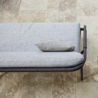 Refined Roberti Rattan Capri sofa crafted with durable searope and muted gray textile with powder-coated aluminum frame