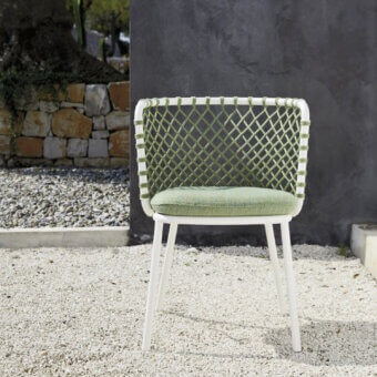 Lavish Roberti Rattan Charme armchair crafted with muted olive-green Flat Trendyrope and powder-coated 304 steel frame