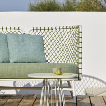 Exceptional Roberti Rattan Charme sofa crafted with white powder-coated steel and woven Flat Trendyrope with light green and muted blue cushions