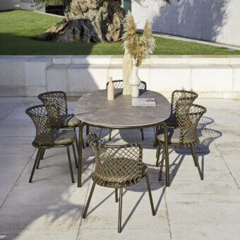 Sophisticated Roberti Rattan Charme table with grey HPL top and dark green powder-coated steel frame crafted in Italy