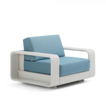 Refined Roberti Rattan Hamptons lounge chair with aluminum and Sunweave frame, complemented by muted blue cushions for comfortable seating