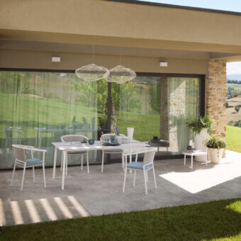 Superior Roberti Rattan Lipari table with a durable HPL tabletop and powder-coated stainless steel base in a striking white finish