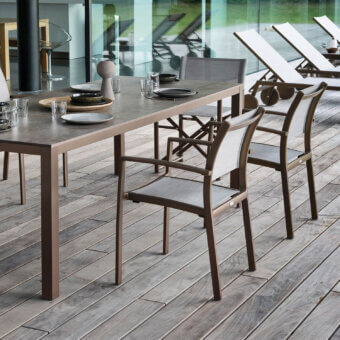 Exceptional Varaschin Victor armchair with metal frame and woven textile in a muted brown tone offering stackable functionality