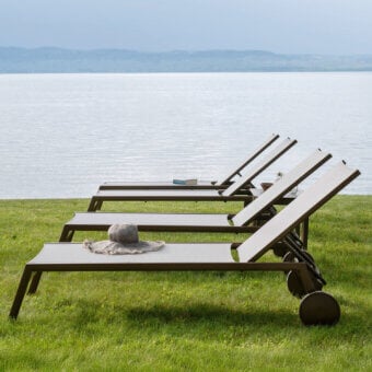 Distinguished Varaschin Victor lounger with aluminum build and earthy brown perforated Batyline fabric offering a textured finish