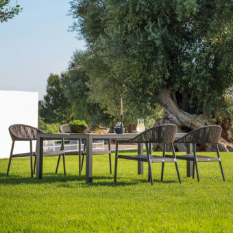 Superior Varaschin Victor low table with dark gray metal frame and matte woven synthetic tabletop for relaxed outdoor settings