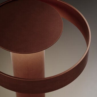 Elegant VENICEM Circle Table Lamp with metal construction and burnished copper finish diffusing warm light