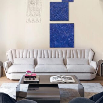 Superior Visionnaire Hemingway sofa with subtly textured off-white woven fabric and sculpted armrests built with a solid wood structure