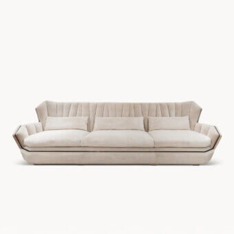 Distinguished Visionnaire Hemingway sofa with neutral beige plush velvet upholstery, curved lines and decorative zipper detail