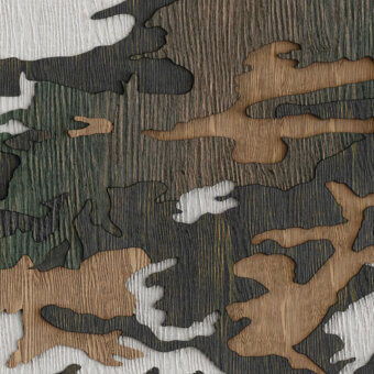 Exceptional Wall&Decò Hiding In Barks wallpaper with abstract camouflage in white, tan and earthy greens on organic bio-vinyl with fabric-effect finish