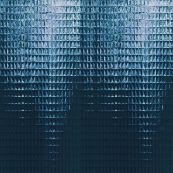 Distinguished Wall&Decò Skin wallpaper presents a sleek geometric pattern in deep teal with silvery-blue highlights and a three-dimensional surface