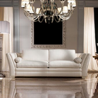 Elegant Zanaboni Amalfi sofa with a low profile and curved silhouette in off-white matte textile and luxurious goose down cushions