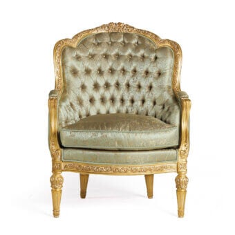 Distinguished Zanaboni Aura lounge chair crafted with gold and ivory patina, textured upholstery subtly toned gold and green, with ornate carvings