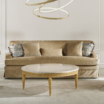 Distinguished Zanaboni Chagall sofa upholstered in textured gold textile with hand-finished floral cushions in blue and cream patterns