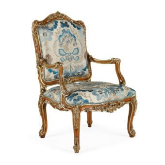 Distinguished Zanaboni Gaia lounge chair with blue floral damask upholstery and glossy golden wood finish