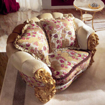 Distinguished Zanaboni Renoir Lounge Chair upholstered in floral damask textile with precious gold carvings on solid wood structure