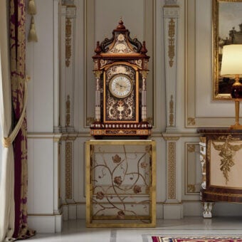 Distinguished Armando Rho A1427 clock crafted in California walnut burl with gilded accents and a noble marble top